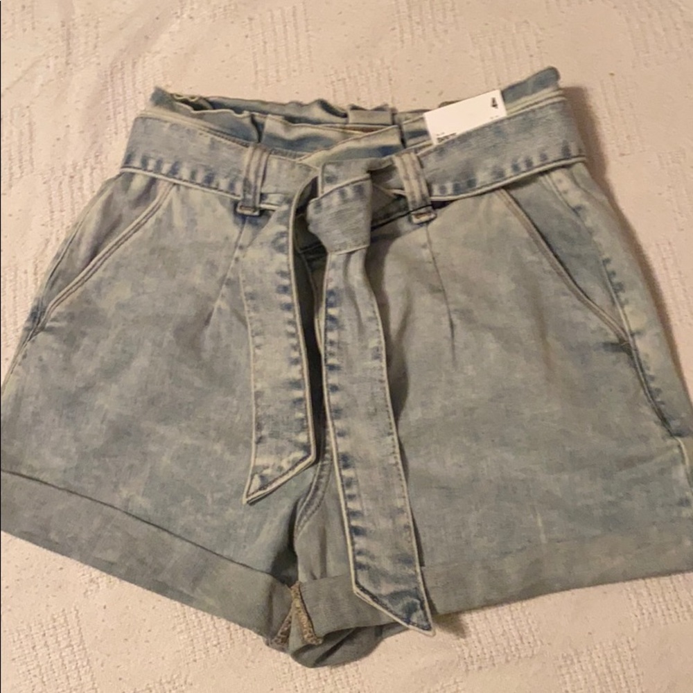 Super high waisted light wash shorts.